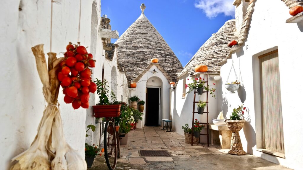 Sun shines on trulli homes in Puglia, Italy